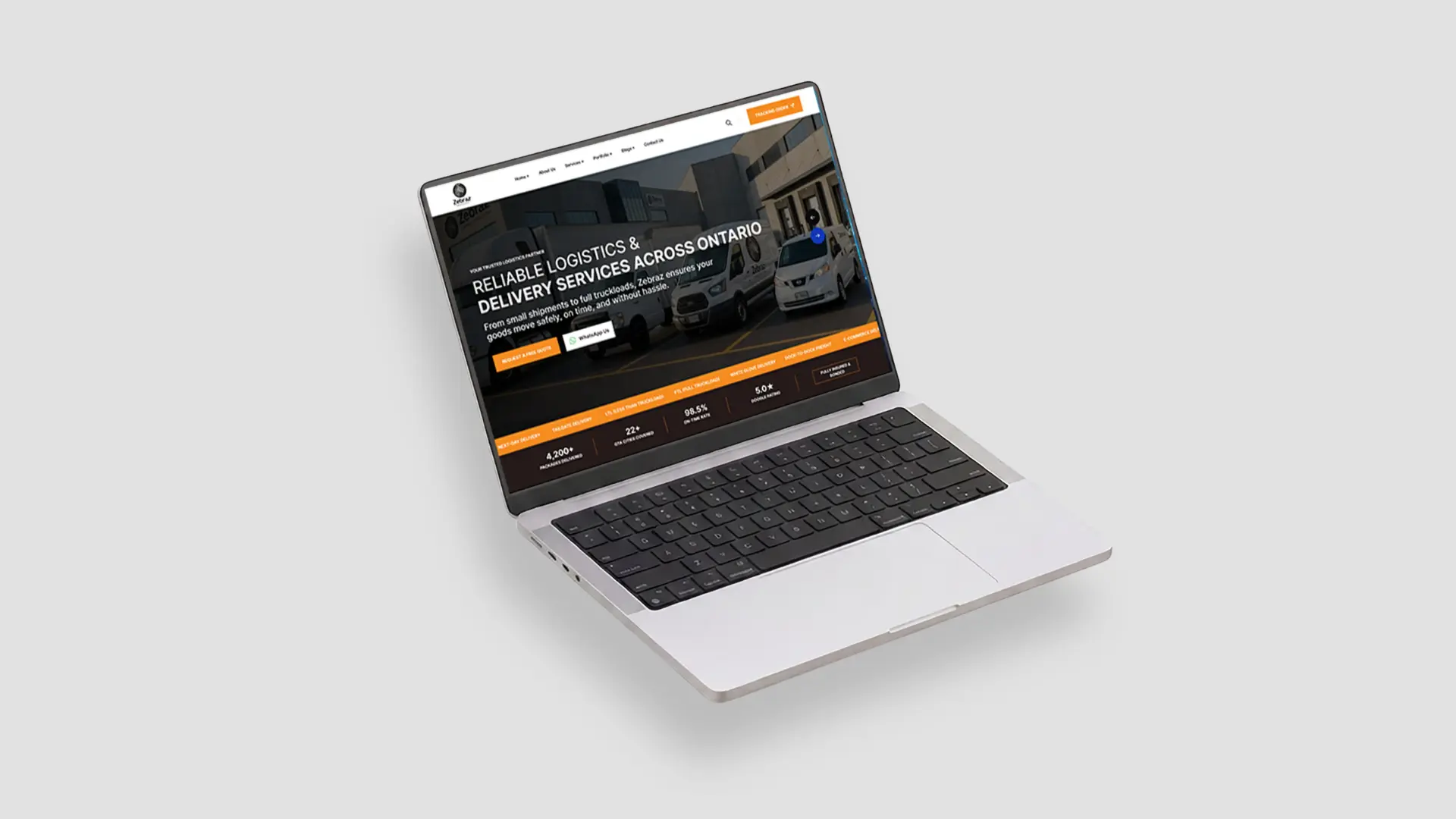 A laptop displaying a logistics company website homepage, showcasing a website development project for a logistics and delivery service brand.